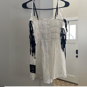 White Sleeveless Top with Black Ties